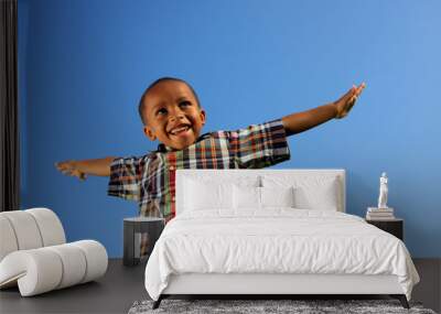 Boy pretending to fly Wall mural