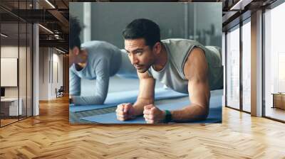 Couple, fitness and gym workout of training friends together for a core strength exercise for abs. Strong, sports and athlete wellness cardio of people doing a sport in a health club or studio Wall mural