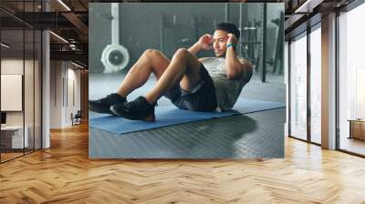 Exercise abdomen training, man and fitness body workout in gym. Young Asian person athlete, healthy sports wellness goal and core muscle power crossfit motivation on yoga mat in health studio Wall mural