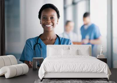 Smile, nurse and portrait of black woman with arms crossed in hospital for healthcare, wellness and nursing career. Face of happy African surgeon, confident medical professional worker and employee Wall mural