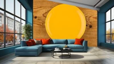 yellow plate on wooden table Wall mural