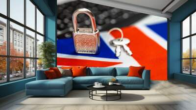 United Kingdom cyber security concept. Padlock on computer keyboard and UK flag. Close-up view photo Wall mural