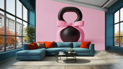 Black kettlebell with a pink bow on a pink background. Women' s day, Valentine's Day, Mothers day, Fathers day. Wall mural