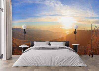 Scenic mountain landscape with autumnal hills, cloudy blue sky a Wall mural