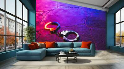 handcuffs on the floor at night Wall mural