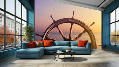 Ship steering wheel, commonly known as helm, with the ocean at sunset in the background. 3D Rendering, illustration Wall mural