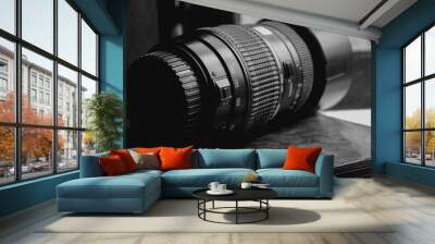 telephoto lens for a DSLR sits in the window frame Wall mural