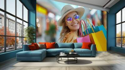 Happy beautiful girl with shopping bags, at mall Wall mural