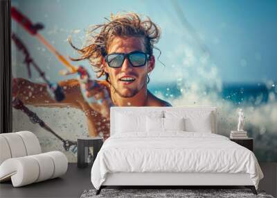 Adventurous young man riding the waves while kitesurfing in the ocean Wall mural