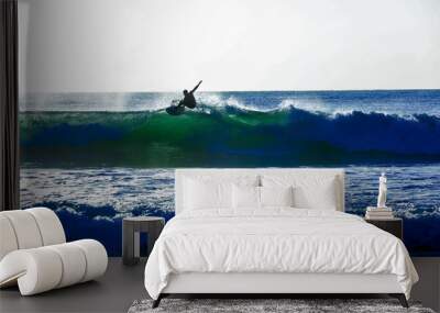 Wilmington,North Carolina,USA,October 2019, Surfer jumping on top of a Wave. Wall mural