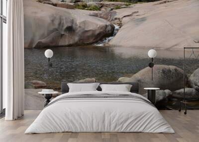 transparent lake in the middle of the rocks in la pedriza in madrid spain Wall mural