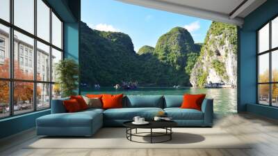 Floating village and rock islands in Halong Bay, Vietnam, Southeast Asia. Travel destination and natural background. Wall mural