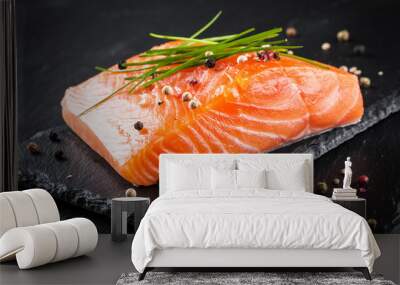 Fresh raw salmon fillet on the black cutting board Wall mural