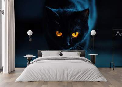 Black cat with orange eyes in the background of lights Wall mural