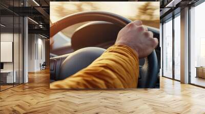 Close-up of male hands on steering wheel. Man driving a car Wall mural