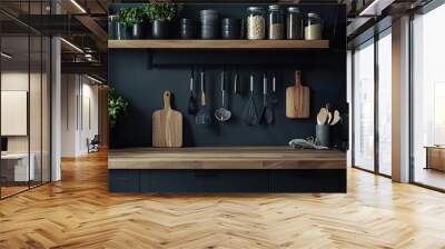 Kitchen interior with black walls, wooden countertops and wooden shelves with cooking utensils Wall mural