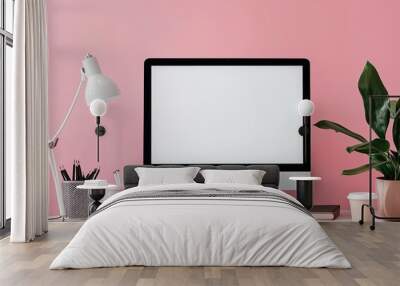 Mockup image of desktop with blank white computer screen and office supplies on wooden table Wall mural