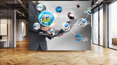 Businessman holding social media concept. Wall mural