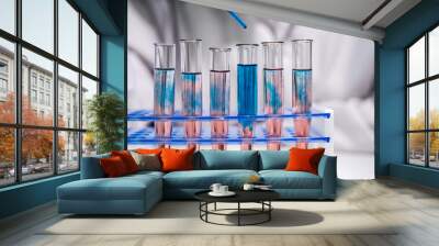 Mixing two solutions in several test tubes Wall mural