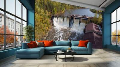 Water spills over the top of Dam Wall mural