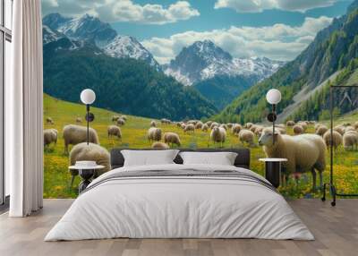 A herd of sheep grazes on green wild meadow Wall mural