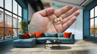 Adult male hand full of pills Wall mural