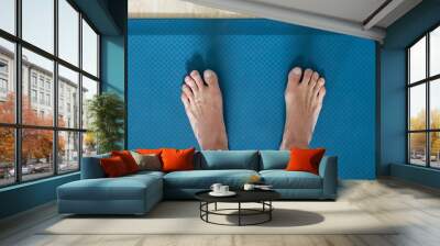 feet on anti fatigue floor mat for standing work Wall mural