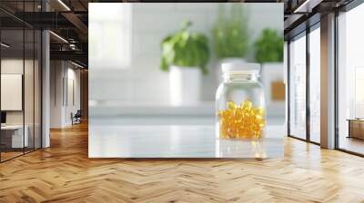 Jar of yellow dietary supplements on kitchen counter with green herb plants in background Wall mural