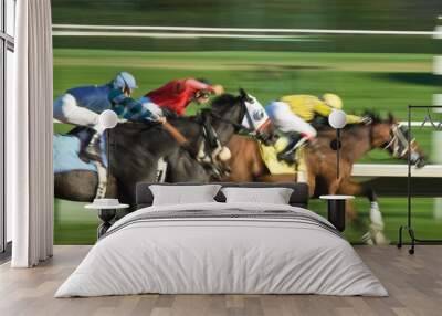 three racing horses in fierce competition for the finish line Wall mural