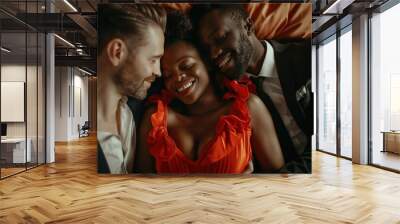 The concept of a threesome. A woman and two men in love. An African woman in a red dress and two men in suits in the same bed. Polygamy or bigamy. Wall mural