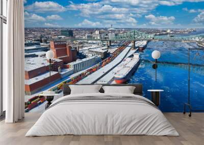 Ship waiting at Montreal Port with Jacques Cartier Bridge in background Wall mural