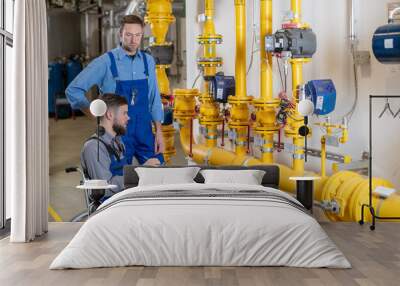 disabled worker in wheelchair in factory and colleague Wall mural