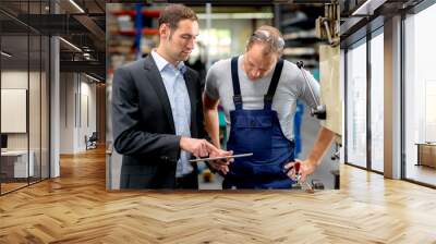 young boss and worker in conversation Wall mural