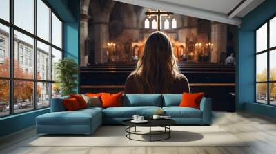 Back view of woman in catholic church Wall mural