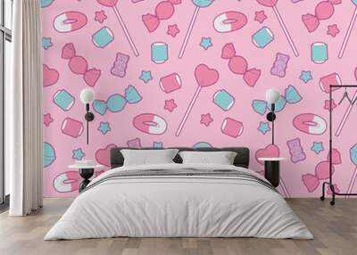 Cute pastel pink colored seamless pattern with different candy like fruit gums, lollly and stars Wall mural