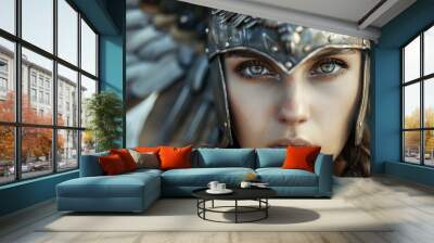 Young woman's face covered in winged Norse mythology Valkyrie helmet Wall mural