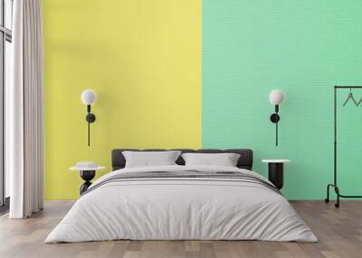 Two-color paper background. The background is yellow and delicate mint color, divided vertically equally. Wall mural