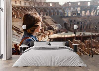 young girl with backpack exploring inside the colosseum (coliseum) Wall mural