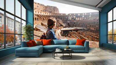 young girl with backpack exploring inside the colosseum (coliseum) Wall mural