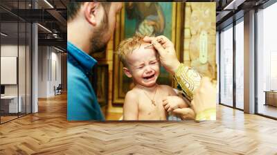 The little boy at the ceremony of baptism of the child in the Church Wall mural