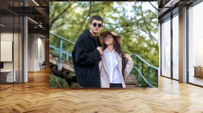 Young international couple in love walking Wall mural