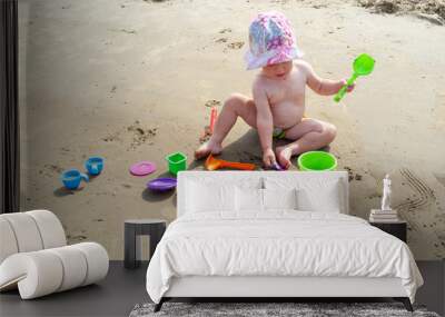 Sisters play in the sand on the beach, summer, heat, toys Wall mural