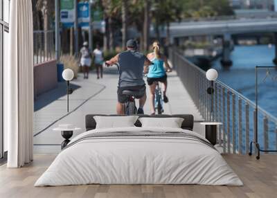 Man and Woman Riding Bikes on a Summer Day	 Wall mural