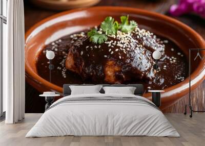 A dish of mole negro, a rich black mole sauce served over chicken, garnished with sesame seeds Wall mural