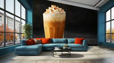 A glass of hot pumpkin spice latte topped with whipped cream and a sprinkle of nutmeg, on a deep black background with subtle orange highlights Wall mural