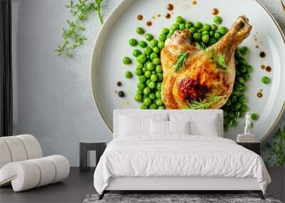 A gourmet dish of green peas with roasted chicken, placed on a light gray background with elegant gold decorative elements Wall mural