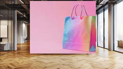 A gradient rainbow shopping bag on a light pink background Wall mural