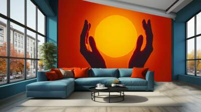 A silhouette of two hands forming a circle, with a fiery red and orange gradient behind Wall mural