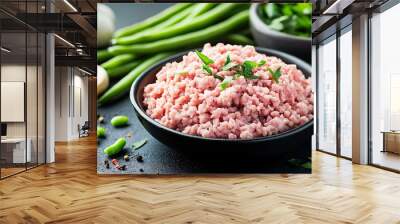 Raw ground pork placed next to minimalist garlic cloves and fresh green beans Wall mural