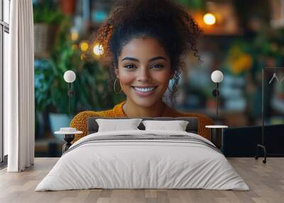  Inclusive image of happy blasian woman working on computer in creative agency office workplace. Young successful mixed race female businesswoman talking on client video call team meeting Wall mural